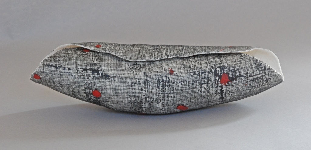 Shelter 1, 4"hx5"wx15"l, wool, cotton, wax, pigment, wet-felting, photo: Carmella Karijo Rother.