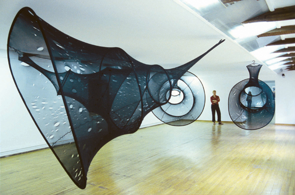 Wounding, 2000-2002, nylon, plastic hose, different cutting tools, scissors, knives, hangers, dimensions variable