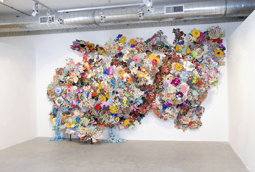 Frosty pink lipstick smeared all over his face, paper, acrylic paint, fabric, masonite, embroidery, crochet, heat press with foil, sequins and other sewn embellishments, metal pipes. 2010, 20' x 10' x 5', photo: Jessica Labatt