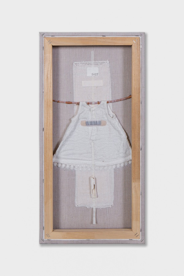 Relics, vintage doll dress, linen, shell, ivory willow branch, band aid, thread on canvas – 2013, 24" x 12". Photo: Christian Carlson. The remnants of childhood: precious objects whose meaning has been lost, wounds that are no longer remembered but whose scars remain. The beauty and loss of memory!
