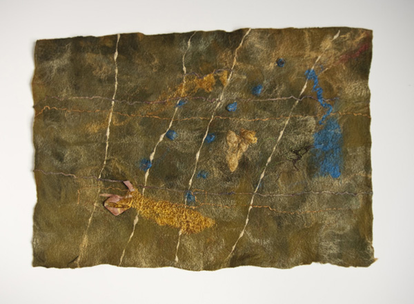 Termite Mounds reconceptualized, 2010,36 H x 24W x 3 D inches - framed, Merino wool, throwsters waste silk, silk roving, synthetic yarn, cricula, cocoons, silk yarn, embedded organics – peacock feather, birch bark. Technique: Handmade felt – wet felting. Photo: Shawna Eberle
