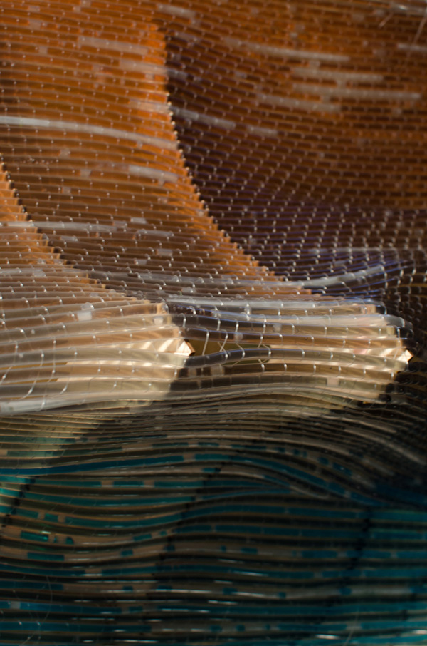 Escape The Womb, 15in X 23in X 9in, polyethylene tubing, fishing line, colored water, laser cut 1/8 plywood, loom weave