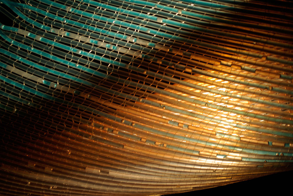 Fabric body, 10in X 14in X 5in, polyethylene tubing, fishing line, coloured water, loom weave