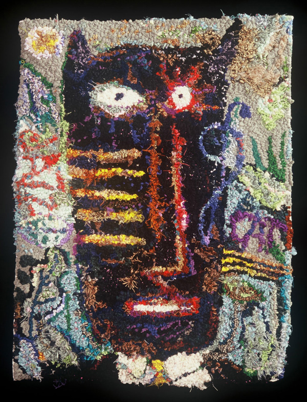 Jazz Cat rug. 1993 2' x 3' Scraps of all fabrics, from ball gowns to T-shirts to ribbons. Hand-hooked