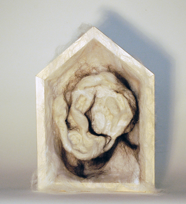 Cocoon, 12"x 9" x 3", wood, wool and silk roving, fibre technique: needle felting, photo: Woman King Collective.