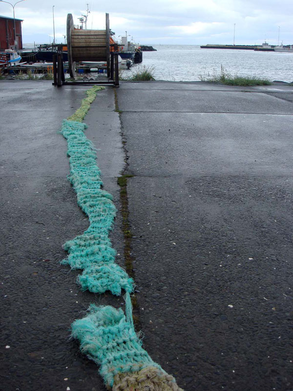 Nets (progress shot), reclaimed hay nets, knitting technique, found spool, Skagastrond, Iceland, 2010