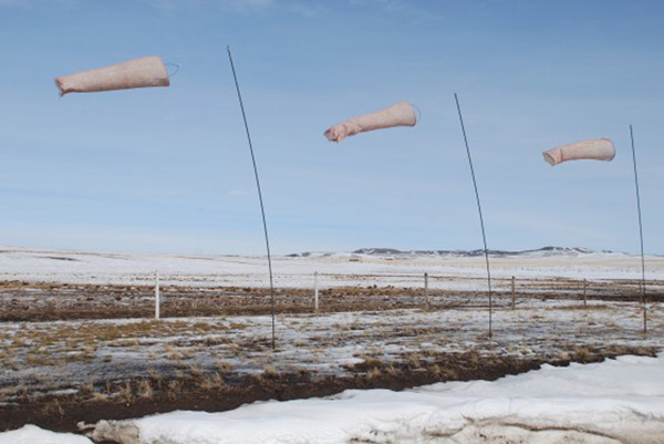 Air over land, 320 cm H, other dimensions variable. Linen, wool, steel, wind, knitting, felt. Photo: M Kelly-Frère.