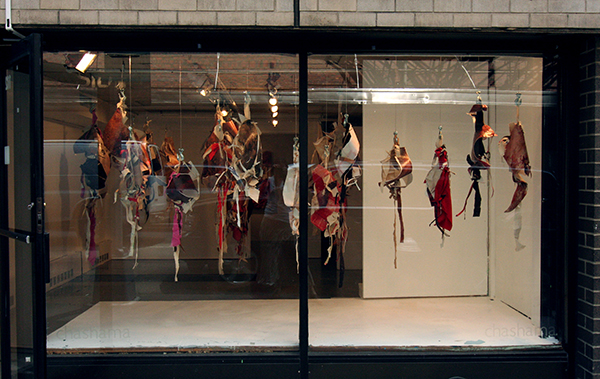Meat Market, (window installation at Chashama, NYC), Acrylic & Oil on Canvas and Paper, Raw Canvas, Cloth and Meat Hooks, 2007, 366cm W x 122cm H x 91cm D, hand knotted installation. Photo: Courtesy of the artist.