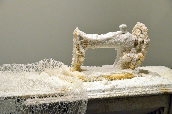 Sweetness of the Work, salt and paper encrusted singer sewing machine from 1901; cotton embroidery and hand spun linen paper thread over 100 hand made bobbins, 380 cm x 360 cm (room), 2013. Photo: Noelle Hamlyn