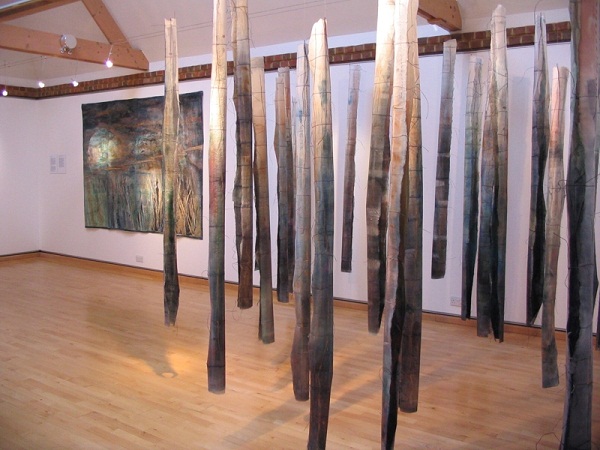 Pendulous and Nocturne, Waterland series, Beneath The Surface touring exhibition. Installation at the Riverhouse Gallery, Walton-on-Thames, UK. Work based on poems by Sylvia Plath. Paper and textiles layers, dye, paint, print, machine and hand, embroidery. Pendulous 40 pieces each 200x10x10cm, Nocturne, 200x160cm. Photo: Cas Holmes.