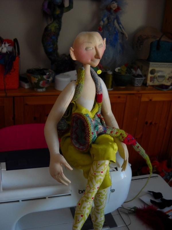 Figure, 10" seated, Cotton fabric, Poly-fil stuffing, sock yarn, silk, pencil outline for the face. Starting to work on a basic figure. Costuming details are still being worked out. The face has been started. Photo: Heike Blohm.