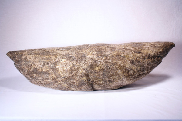 POD (Grey), wool, beeswax, thread, recycled fill, 2012, 10.5" x 38" x 12", hand-felted, stitched, encaustic. Photo: Merce Mitchell