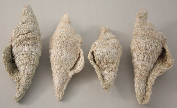 Sea Shells, work in progress, free motion embroidery on water soluble fabric tension and direction manipulation, 3" x 1"