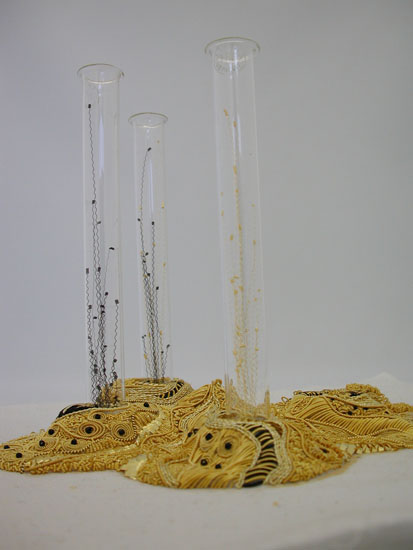 Spore, glass test tubes, padding, cotton, metal and metallic threads, crystal beads, contemporary goldwork (stitch), 7"hx8"wx6"d, photo: C. Jackson  