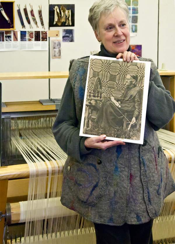 Artist: Temma Gentles with Muse. "I'm holding a 1950's-60's 
Life Magazine photo of a 93-year-old Appalacian weaver 
whose joints obviously work better than mine.."