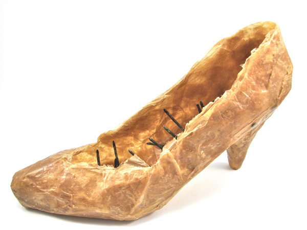 In Her Shoes, 2012, 15 H x 25 W x 9 D cm, Tissue Paper, Encaustic Wax and Rusted Nails.