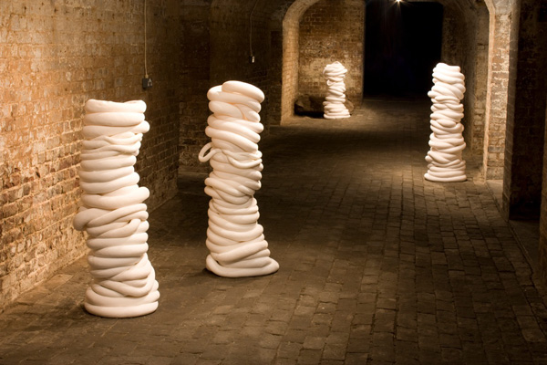 becoming … , 2009-2011, 7 columns each 140 x 40 x 40cm, cotton velvet, polypropylene pellets