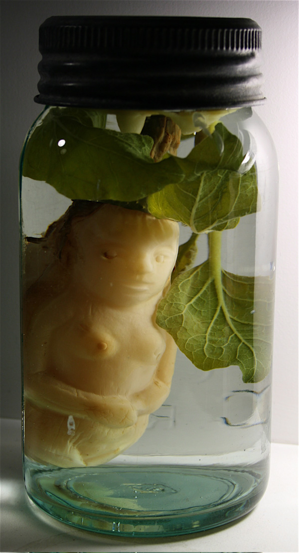 Product of Eden, 2007, eggplant, brass, brine, beeswax, glass jar,  7 x 3.5 x 3.5"