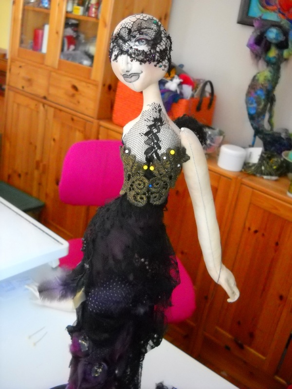 Flight of Fancy, 18" tall. Wooden base, cotton fabric, Poly-fil® stuffing, silk, organza, lace, feathers, beads, pencil crayon and pencil (for face colouring). The figure is partially dressed. I'm still working on placement of arms. The face is halfway there. Photo: Heike Blohm.