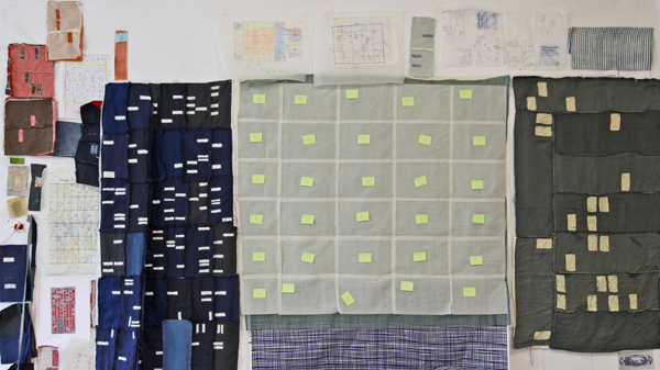 Work wall with Chicago, Miami and Cape Coral Foreclosure Quilts, photo credit: Kathryn Clark.