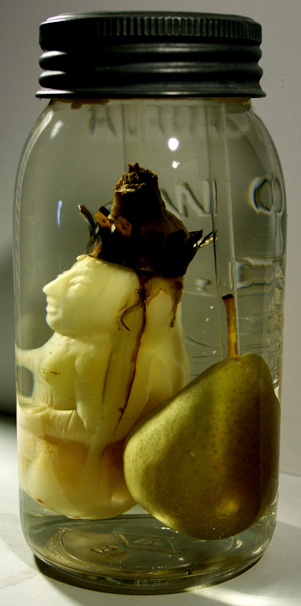 Product of Eden, 2007, eggplant, brass, brine, beesewax, pear, glass jar, 7 x 3.5 x 3.5"