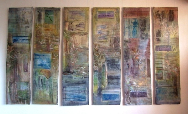 Shorelines, Waterland series, Beneath The Surface touring exhibition. Installation at the Metropole Galleries, Folksetone, UK. Paper and textiles layers, dye, paint, print, machine and hand embroidery, 6 panels each 40x160cm. Photo: Cas Holmes.