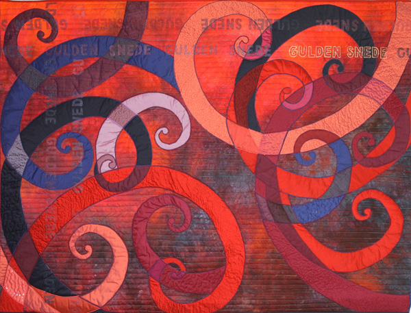 Gulden Snede (Golden Ratio) (131 x 100 cm), Materials: silks, cotton, organza, beads

Side curls, drawn by the method of the Golden Ratio are appliqued on a cotton cloth, dyed by Heide Stoll-Weber. Larger curls are stitched in order to minimize the rounding. Smaller squares are decorated with beads and as a variant some are tied with embroidery thread. There are horizontal and vertical lines of text, consisting of letters of organza.