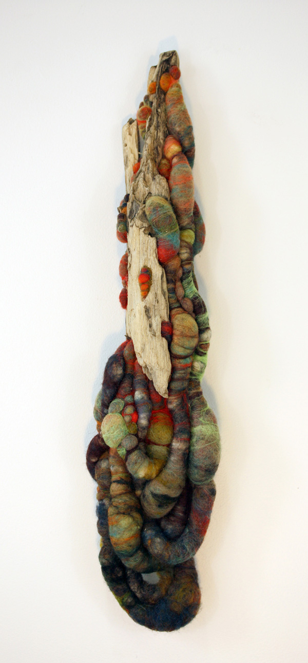 In the Beginning – 6 x 20 x 6 in., wool and found driftwood; needlefelting. Photo by artist.