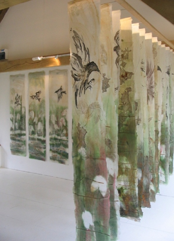 Counting Crows, (and As the Crow Flies background - Land series). Installation Land at Cowslip Farm and Gallery, Cornwall. Paper and textiles layers, ink drawing, dye, paint, print, machine and hand embroidery. 10 panels each 180x40cm. As the Crow Flies, 4 panels each 180x60cm. Photo: Cas Holmes