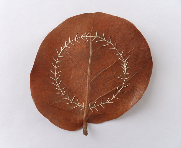 Garland stitched leaf, hand stitched sea grape leaf (coccoloba uvifera), silk/cotton thread, 2014, 3.5" x 3.5" Photo: Christine Mauersberger