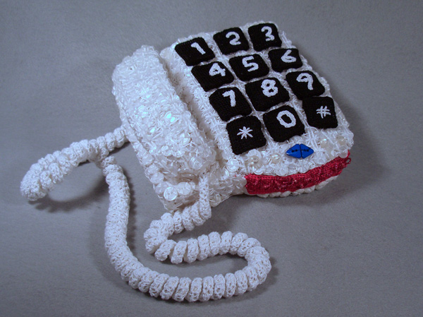 Final Phone, 2010, 3 1/2"H x 12"W x 9"D (variable by cord arrangement), Mixed Media Sculpture:  Antique and new cotton crochet with buttons and beads over wire and needlepoint canvas.  Needlepoint, embroidery and button work.