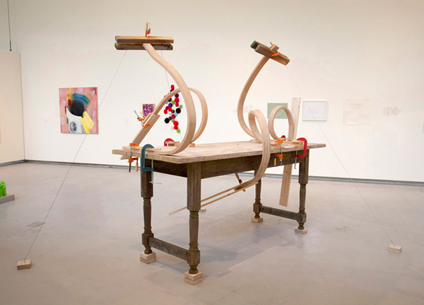 What's Your Favorite Posish?, Hyde Park Art Center, Chicago, IL. Hand-bent hardwood (red oak) on hand- constructed table, collected lumber, clamps, hardware, pastels, paint, wire, 2010, 90"H x 120"W x 144"L, wood-bending and wood construction. Photo: Olivia Valentine