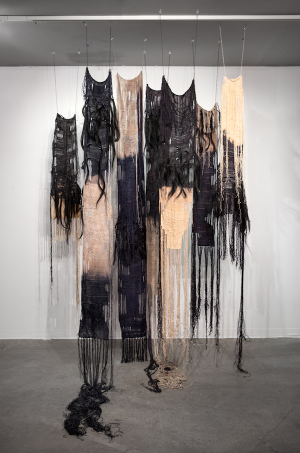 Shrouds, 2014, 8’H x 4 ½’W x 3’D, hand-dyed linen, horsehair & bleach. Technique: Hand-woven and hand-dyed tapestries using plain weave. Warp is linen, weft is linen &horsehair. Photo: Mary Grisey. 