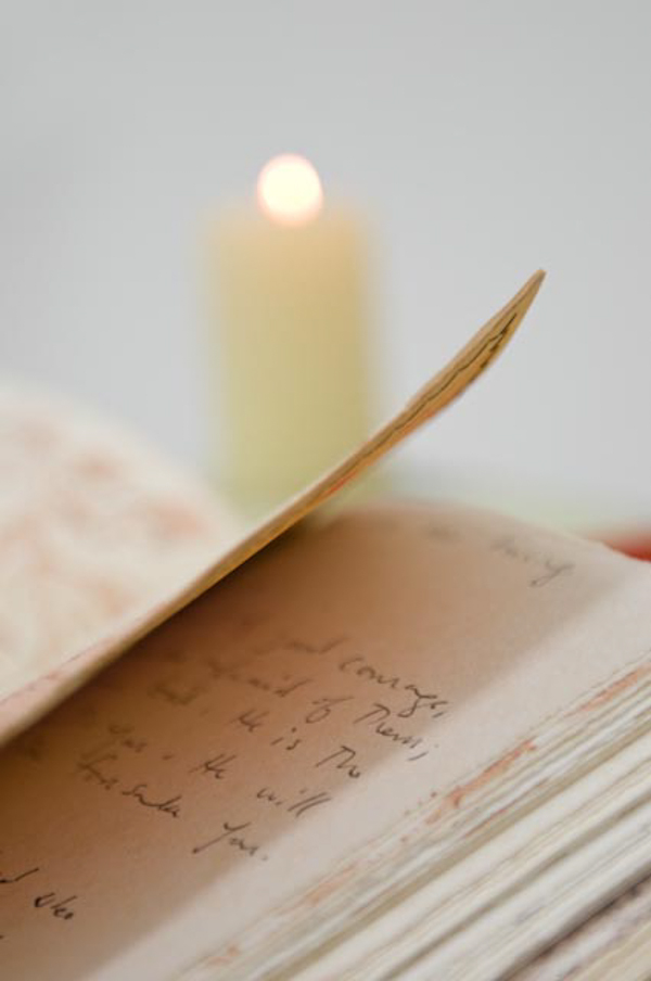 Detail: "Given and Received", Mixed media installation with handmade components, 81" x 20" x 25, 2010. Handmade/painted wooden book display, weaving, handmade collaged book with cross stitch binding and handsewn/dyed leather cover, digitally printed silk with free motion stitching, handmade beeswax candles.