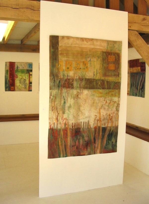 Red Earth, Land series. Installation Land at Cowslip Farm and Gallery, Cornwall, UK. Paper and textiles layers, print, buried sheeting, dye, paint, print, machine and hand embroidery, 160x90cm (private collector). Photo: Cas Holmes.