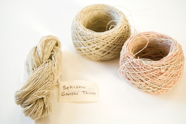 Hand-spun paper threads, 2011, Each ball: 53 cm h x 74 cm w (sheet of paper), Sekishu tsuru washi paper, hand spun, Dip dyed in madder root. Photograph: Lizz Aston