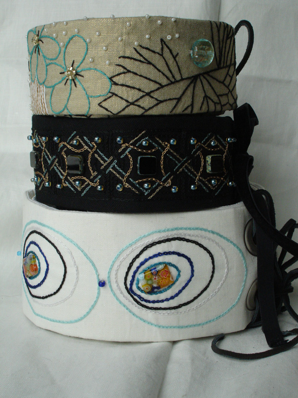 A mix of Belts- various materials, embroidered and beaded.