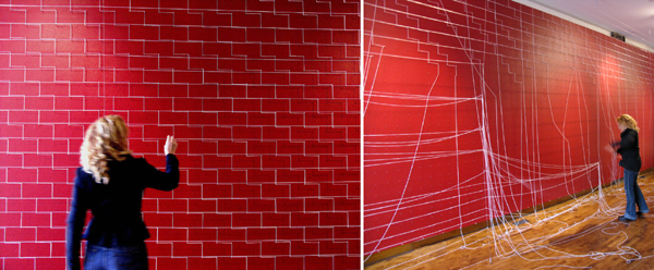 Infinite Wall, 2004-2006 installation and video, elastic ribbon, finishing nails, red paint, 9' x 18' x 2.5')