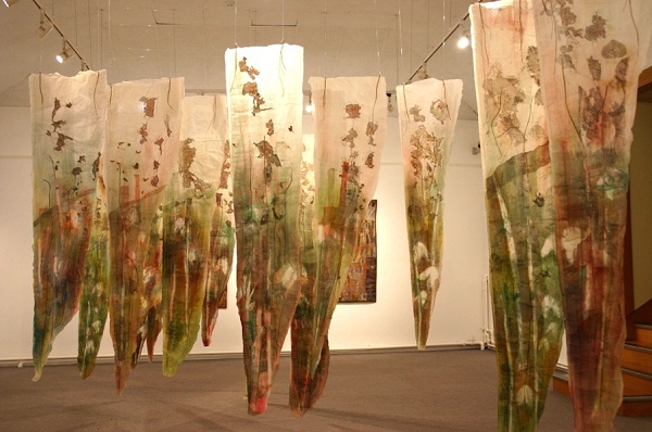 Fen, Land series. Paper and textiles layers, print, buried sheeting, dye, paint, print, machine and hand embroidery. Installation Tunbridge Wells Museum and Art Gallery. 14 Panels each 210x80x4xm approximately. Photo: Cas Holmes.