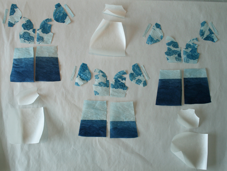 "In process, 2009 - Pattern pieces for three dresses, all part of the 'Quietly Being' edition.  The etching has been printed on the paper and at this point I've cut out the pattern pieces, before beginning to sew.  The non printed pieces comprise the backs of the dresses."