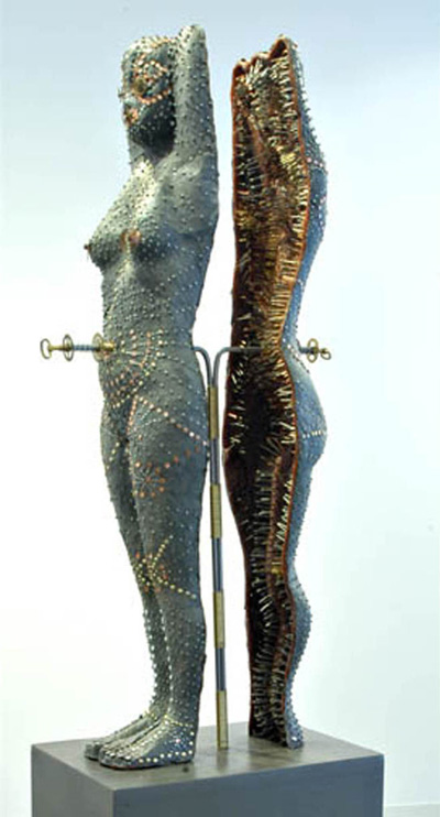 Iron Maiden: (side view), 29"x11"x7", Japanese paper, wax, nails, pins, brass wire, steel, watch parts, wood.