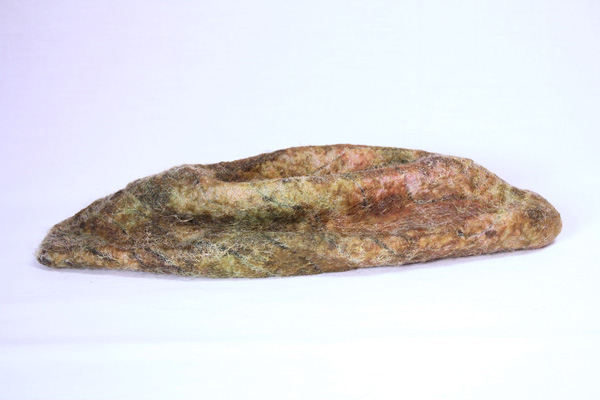 Green Pod, wool, beeswax, 2012, 3" x 13" x 4", hand-felted, encaustic. Photo: Merce Mitchell
