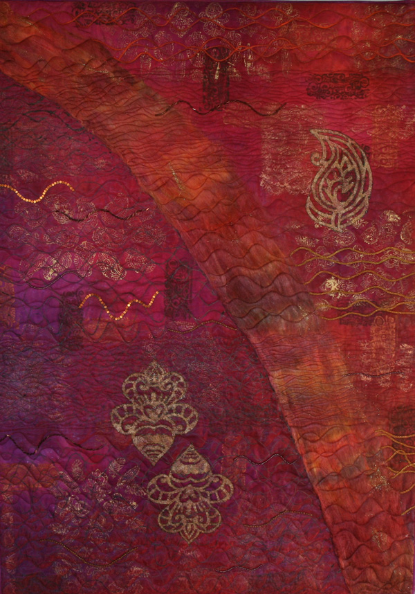 Mumbai (90 x 132 cm), Materials: cotton, oil crayons, rubber, silk threads, organza, beads, angelwire

An experimental quilt based on a beautiful fabric from Heide Stoll. The piece is decorated with oil crayons (rubbings) and stamped with gold paint. On top of that a silken thread has been punched. On the left organza is fixed using liquid rubber. And next parts of the organza have been trimmed away. To support the silk horizontal waves are quilted. These waves are randomly accented with beads and sequins. Two stamps are copied and cut out of angel wire and then put down with some stabbing and gold rubber.