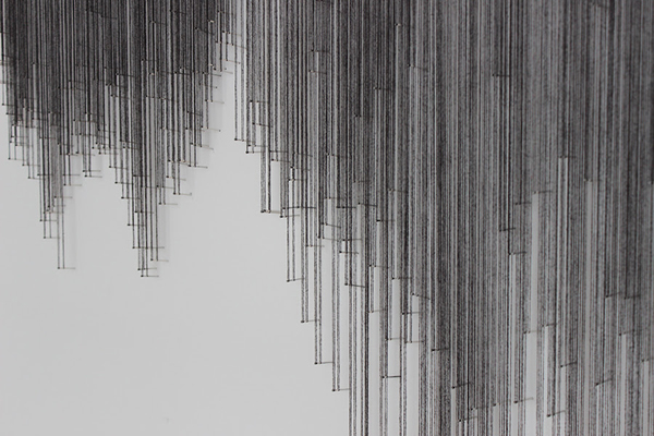 Detail: Hesitations, Artspace Contemporary Art Projects, Peterborough, ON. Thread wound around painted nails on drywall; soundscape, 2010/2012, 36" H x 59 W x 1 ½" D, thread construction. Photo: Fynn Leitch.