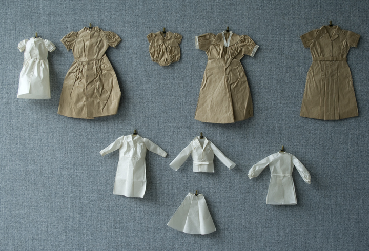 "In process, 2009- A combination of my grandmother's mock ups (larger clothes made up of brown paper), and my mock ups (smaller made out of Japanese, Gampi paper)"