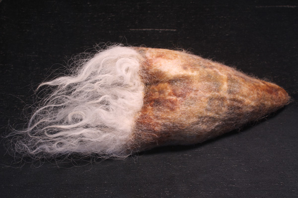 Hair Pod, wool, beeswax, 2012, 5.5" x 17" x 7", hand-felted, encaustic. Photo: Merce Mitchell

