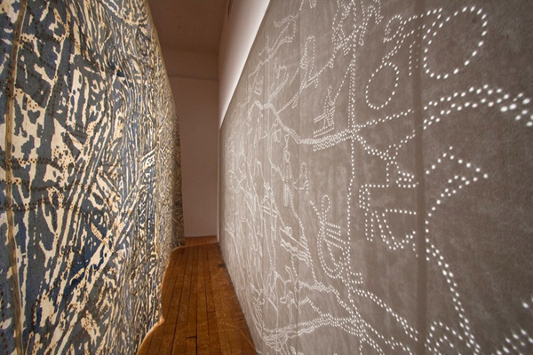 In a Different Light, buckram, pigment, incense, screen-printing, incense burning, 186" (w) x 86"(h) x 24" (d) photo: Xia Gao, Spaces Gallery, Cleveland, Ohio.