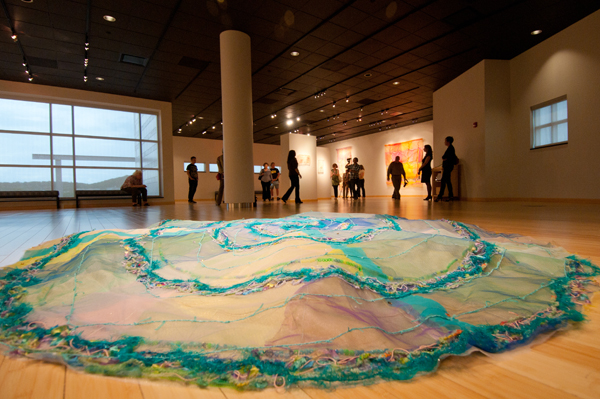 Installation, Penn College, Williamsport, PA. Foreground image: Floor piece Labyrinth, 96" diameter, Industrial mesh, yarn, beads. Photo: Cathy Breslaw.