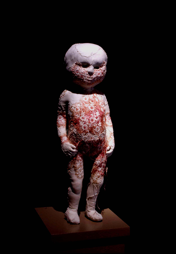 Efflorescence, Figure approx. 13" tall, 1997. Antique christening gowns and children's garments, embroidery, armatures (wool, wood, wire). Photo: Cheryl O'Brian.