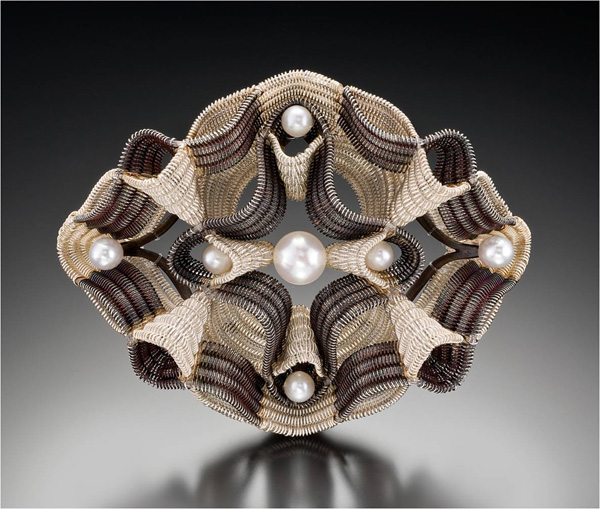 Coaxial Providence Brooch, 2009. Fine silver, sterling, nylon monofilament and pearls. Double-cloth on 4 harness floor loom. Hand forged and fabricated jewelry components. 3 ¼" x 2 ½" x ¾"